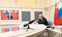Tổng thống Nga Vladimir Putin và Chủ tịch Trung Quốc Tập Cận Bình. Ảnh: Tass