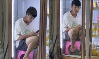 Không chịu nổi nắng nóng, nam thanh niên chui vào tủ lạnh ngồi chơi điện thoại