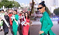 &quot;Đại sứ áo dài&quot; Hoa hậu H&apos;Hen Niê diễu hành với giày thể thao