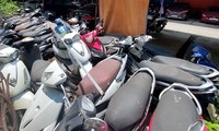 Cả nghìn chiếc xe máy vi phạm hành chính "vô chủ" xếp đống tại bãi trông giữ.