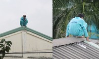 Người đàn ông ngồi trên nóc nhà E bệnh viện Đà Nẵng. Ảnh: Nguyễn Thành