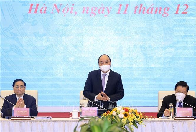 Chủ tịch nước Nguyễn Xuân Phúc chủ trì hội thảo. Ảnh TTX VN.