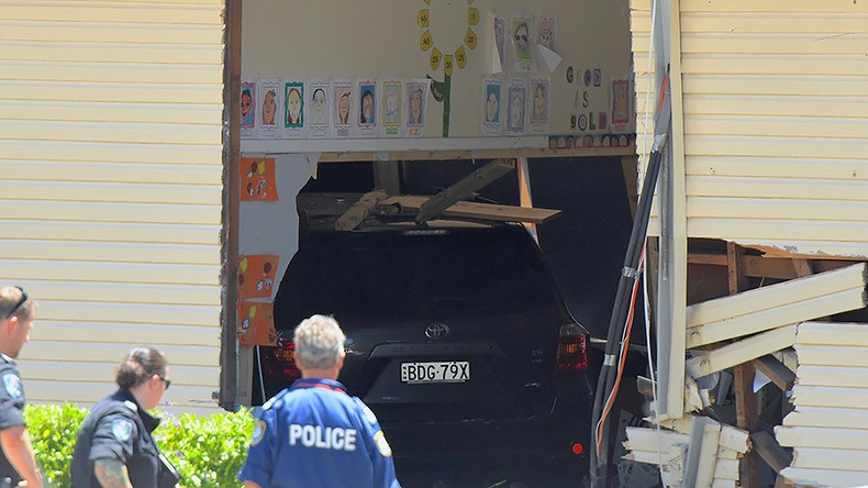 Chiếc ô tô đâm thủng tường phòng học. Ảnh: Reuters