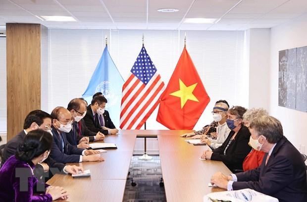 Chủ tịch nước Nguyễn Xuân Phúc tiếp đại diện bạn bè Mỹ nhân kỷ niệm 60 năm thảm họa da cam ở Việt Nam. (Ảnh: Thống Nhất/TTXVN)