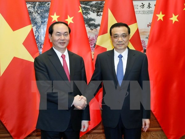 Chủ tịch nước Trần Đại Quang gặp Thủ tướng Trung Quốc Lý Khắc Cường. (Ảnh: Nhan Sáng/TTXVN)