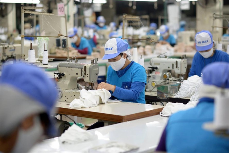 Doanh nghiệp dệt may đối mặt nguy cơ mất đơn hàng cho năm 2022. Ảnh: Nguyễn Bằng