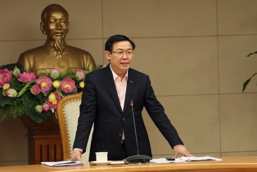 Phó Thủ tướng Vương Đình Huệ chủ trì cuộc họp nghe báo cáo triển vọng kinh tế vĩ mô 2018. Ảnh: VGP.