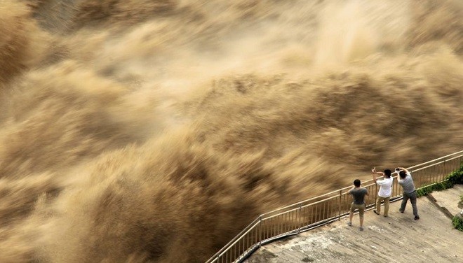 Mưa lũ khiến mực nước hàng trăm sông ở Trung Quốc vượt mức cảnh báo. Ảnh: China Daily