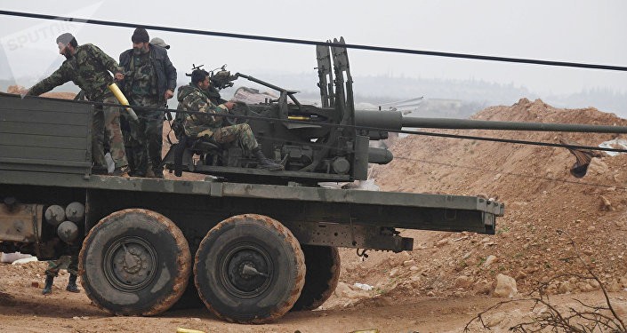 Quân đội Syria xả súng về mục tiêu IS. Ảnh: Sputnik