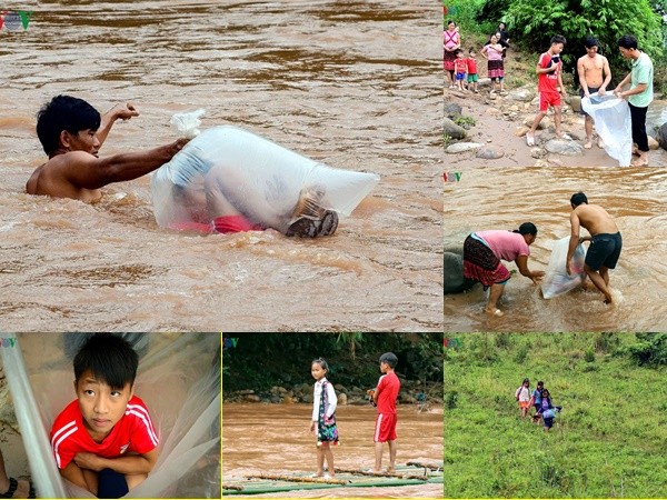 Học sinh Điện Biên chui túi nilon vượt suối lũ tới trường khai giảng